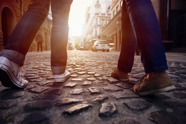 people walking paved road foot massagers